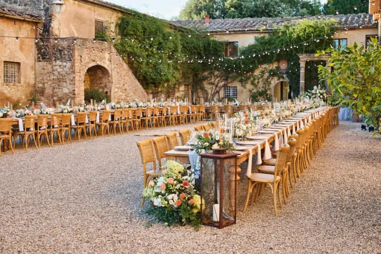 Courtyard dining under festoon lights at dusk